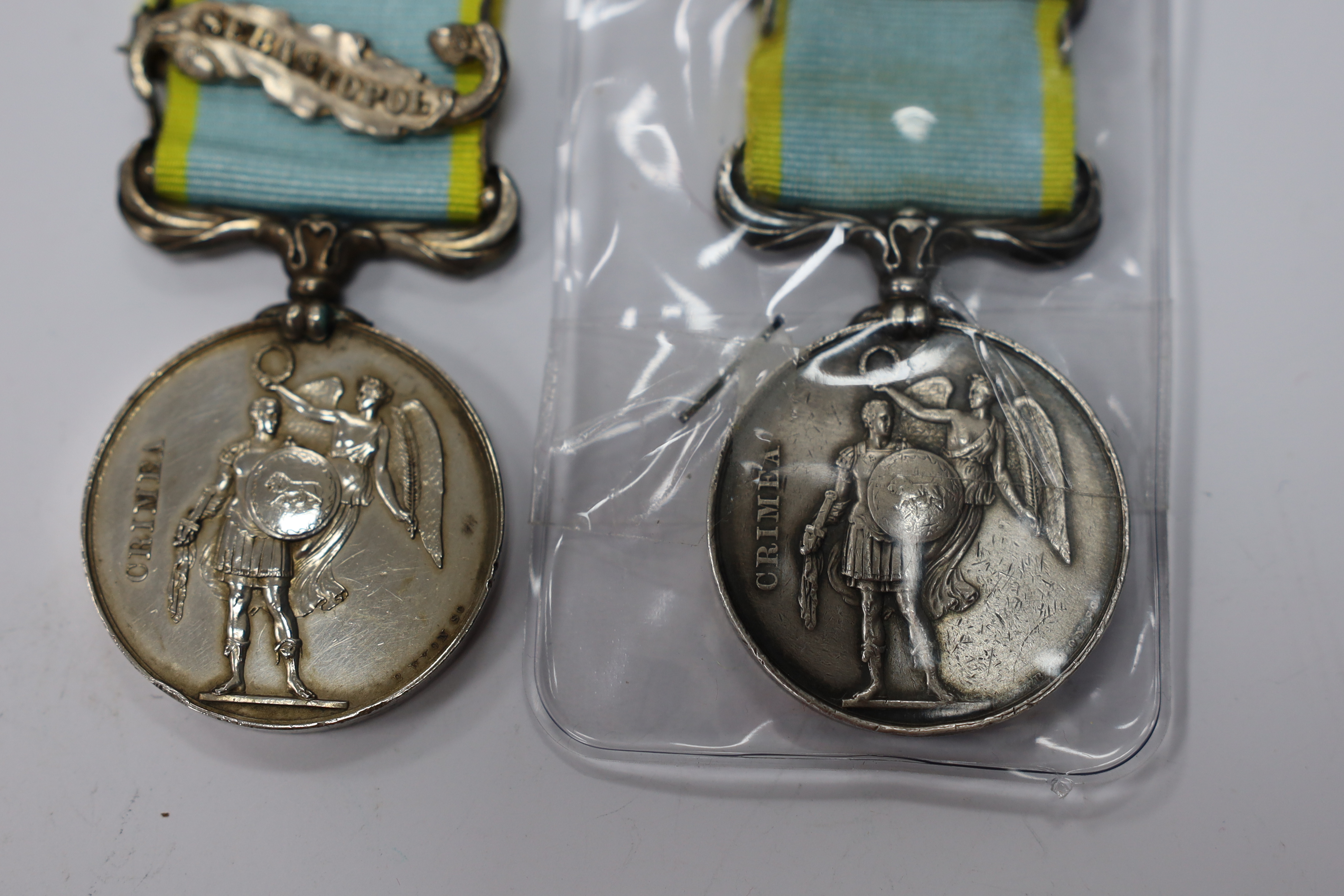 Two Crimea medals; one with Sebastopol clasp, the other Inkermann, both unnamed as issued